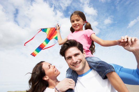 A person with a child on their shoulders